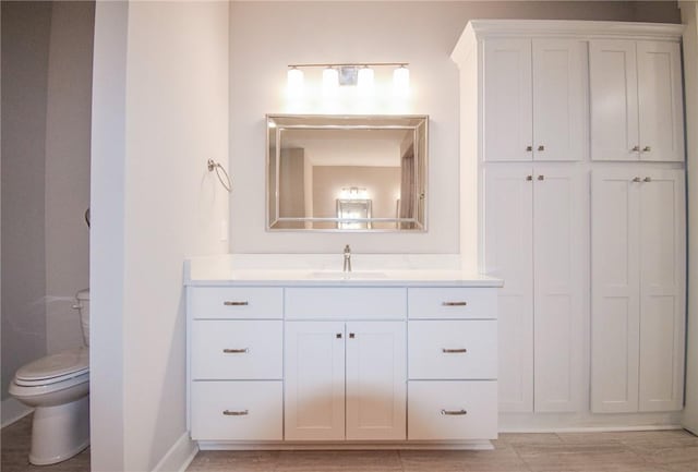 bathroom with vanity and toilet