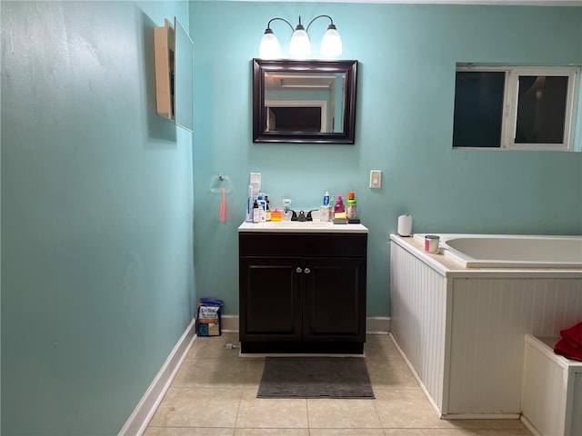 bathroom featuring tile patterned flooring, vanity, and a bathtub