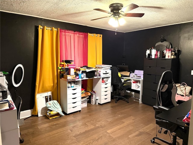 office area featuring hardwood / wood-style floors, a textured ceiling, and ceiling fan