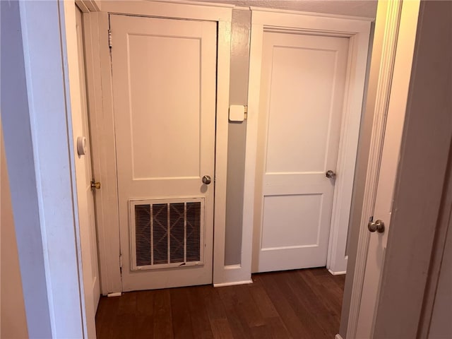 hall with dark hardwood / wood-style floors