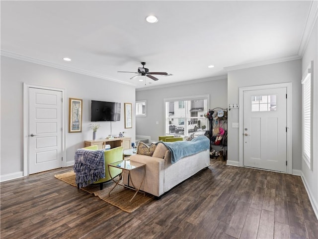 living room with crown molding, dark hardwood / wood-style floors, and ceiling fan