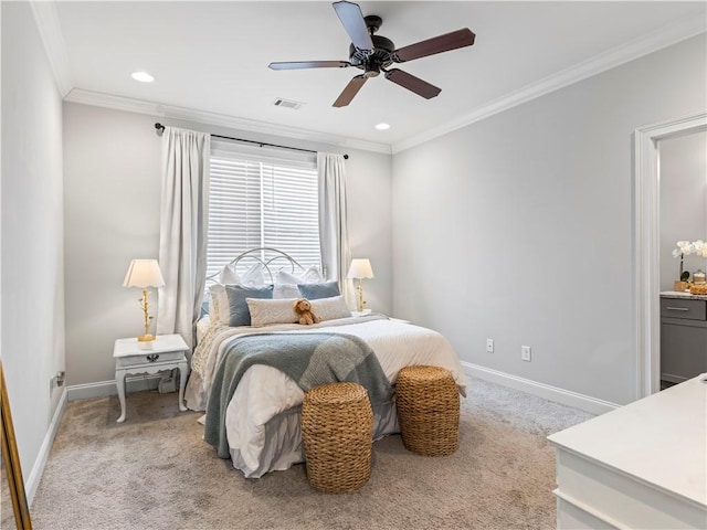 bedroom with ornamental molding, light colored carpet, and ceiling fan