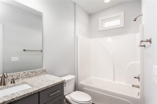 full bathroom with bathtub / shower combination, vanity, and toilet