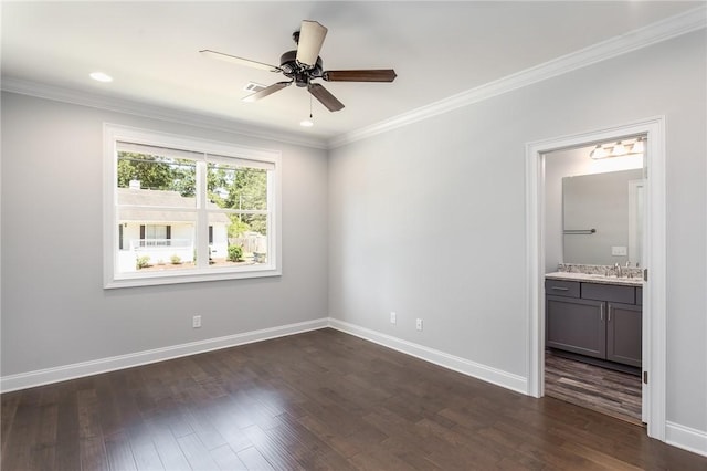 empty room featuring dark wood-type flooring, ornamental molding, and ceiling fan