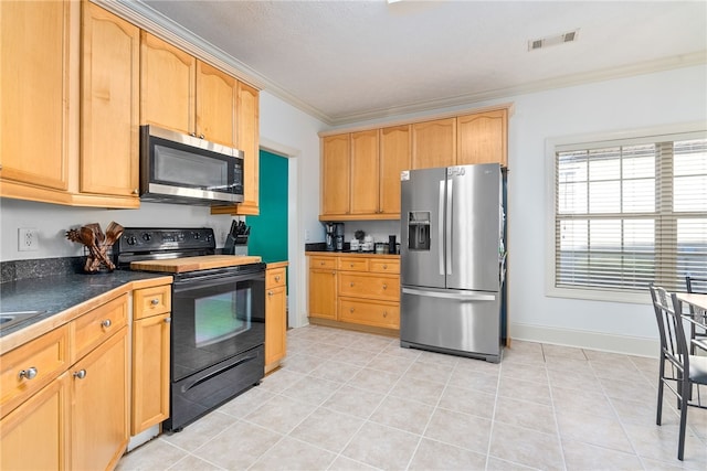 kitchen featuring light brown cabinetry, light tile patterned floors, ornamental molding, and stainless steel appliances