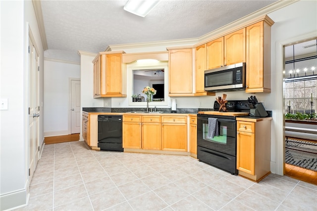 kitchen featuring sink, crown molding, light brown cabinetry, and black appliances