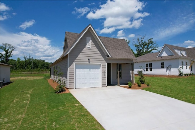 7 Crossing Ct E, Valley, AL 36854 - view of front of property featuring driveway, a garage, a front lawn, and roof with shingles