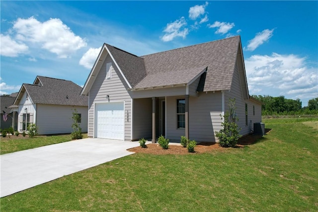 7 Crossing Ct E, Valley, AL 36854 - view of front of house featuring concrete driveway, a front yard, roof with shingles, and an attached garage