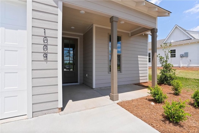 7 Crossing Ct E, Valley, AL 36854 - property entrance featuring covered porch and a garage