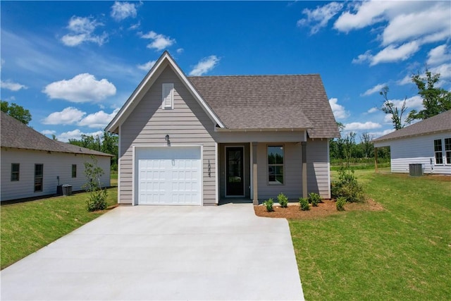 7 Crossing Ct E, Valley, AL 36854 - view of front facade featuring driveway, an attached garage, a front lawn, and roof with shingles