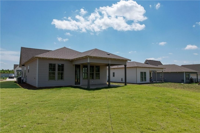7 Crossing Ct E, Valley, AL 36854 - back of house with a lawn and a patio area