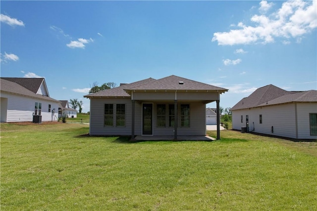 7 Crossing Ct E, Valley, AL 36854 - back of property featuring a lawn and a shingled roof
