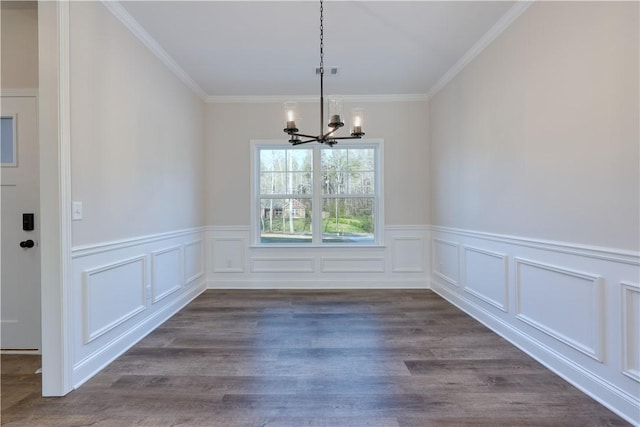204 Lee Rd Unit 2037, Salem, AL 36874 - unfurnished dining area featuring a chandelier, crown molding, a wainscoted wall, a decorative wall, and dark wood-type flooring