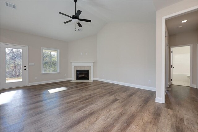 204 Lee Rd Unit 2037, Salem, AL 36874 - unfurnished living room featuring lofted ceiling, dark wood-style flooring, a ceiling fan, a tile fireplace, and baseboards