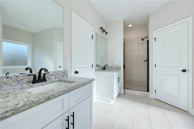 204 Lee Rd Unit 2037, Salem, AL 36874 - full bathroom featuring a stall shower, tile patterned flooring, and two vanities
