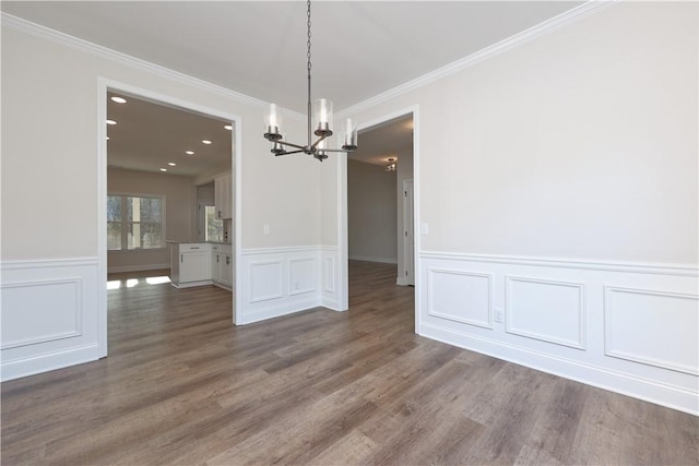 204 Lee Rd Unit 2037, Salem, AL 36874 - unfurnished dining area with a chandelier, ornamental molding, wood finished floors, wainscoting, and a decorative wall