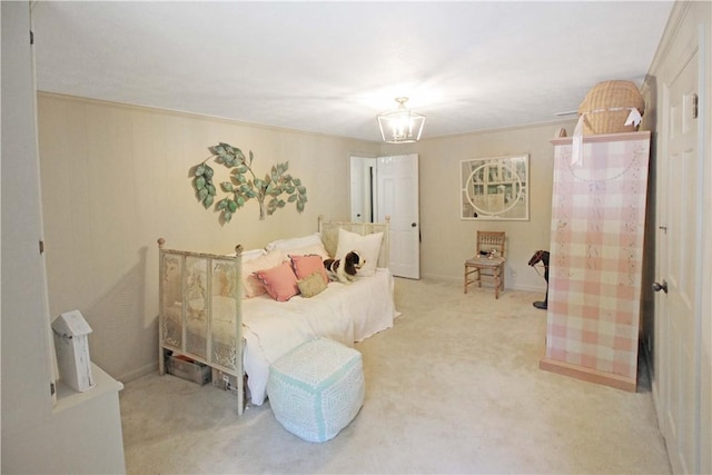 bedroom featuring ornamental molding, light carpet, and a chandelier