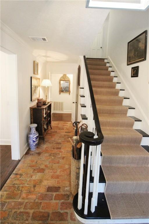 stairs with crown molding