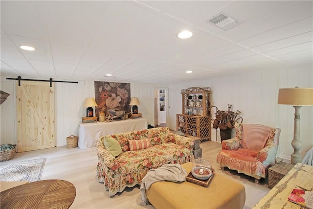 living room featuring a barn door