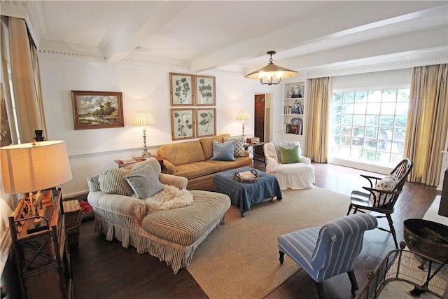 living room featuring beamed ceiling, built in shelves, dark hardwood / wood-style floors, and crown molding