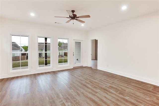 109 Hunters Way, Opelika, AL 36801 - empty room with a ceiling fan, wood finished floors, and recessed lighting
