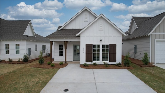 109 Hunters Way, Opelika, AL 36801 - modern inspired farmhouse with board and batten siding, covered porch, and a front lawn