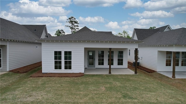 109 Hunters Way, Opelika, AL 36801 - back of property with a patio, roof with shingles, and a lawn