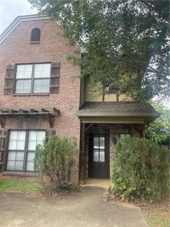 view of front of home with brick siding
