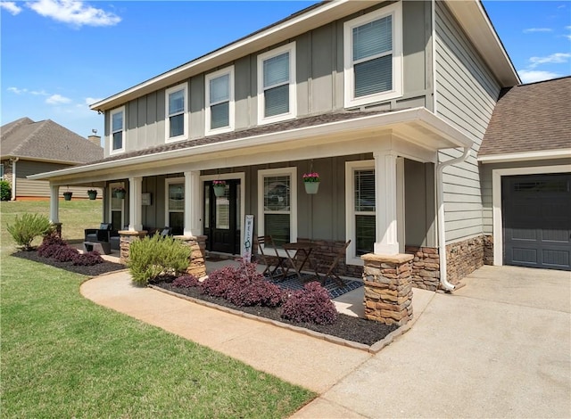 304 Marthas Ct, Opelika, AL 36801 - view of front facade featuring board and batten siding, a porch, stone siding, and roof with shingles