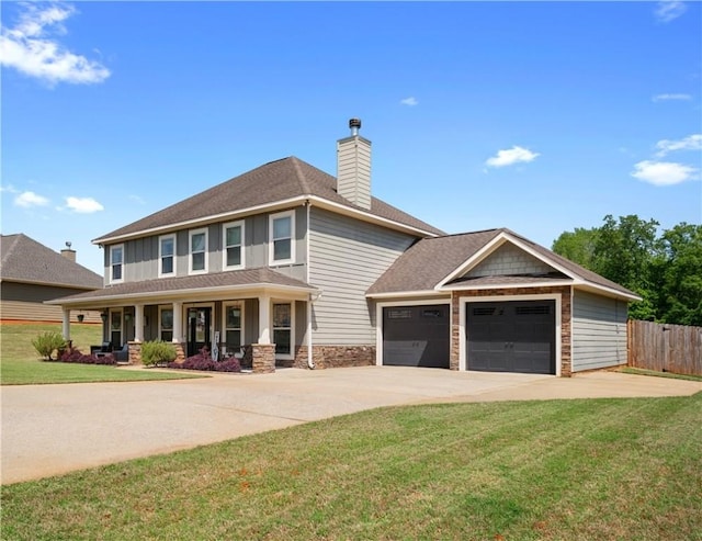 304 Marthas Ct, Opelika, AL 36801 - view of front of house with a chimney, stone siding, driveway, a garage, and a porch