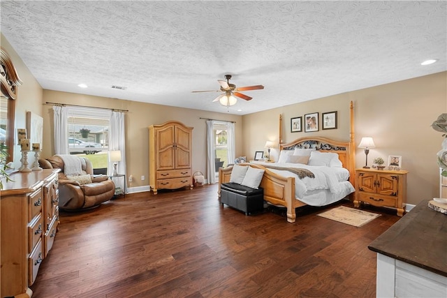 304 Marthas Ct, Opelika, AL 36801 - bedroom featuring dark wood-style flooring, a textured ceiling, a ceiling fan, and recessed lighting