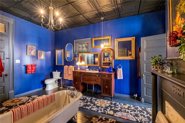 bedroom featuring a chandelier, a sink, an ornate ceiling, and baseboards