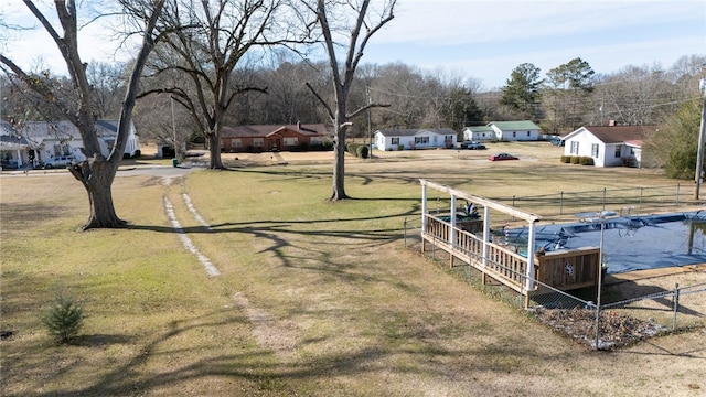 view of yard with a residential view and fence