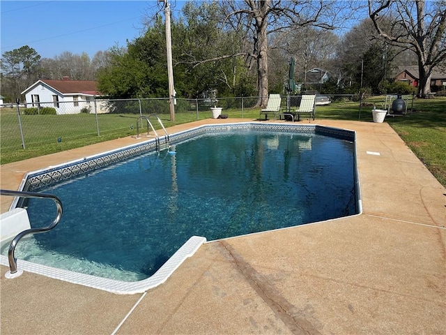 view of swimming pool featuring a fenced in pool, a lawn, and fence