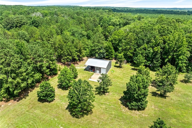1515 County Road 63, Tuskegee, AL 36083 - aerial view of property and surrounding area featuring a heavily wooded area