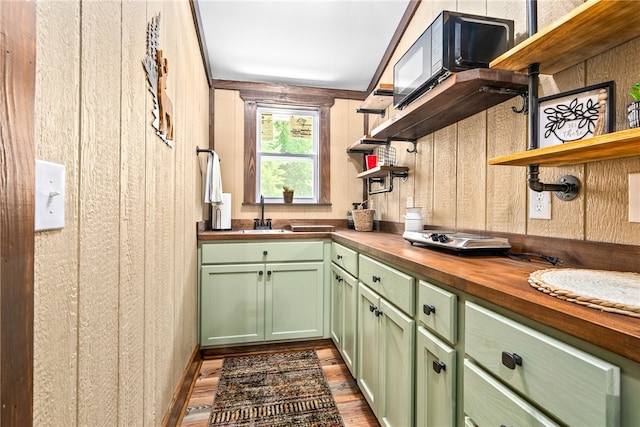 1515 County Road 63, Tuskegee, AL 36083 - kitchen featuring open shelves, green cabinets, butcher block countertops, and dark wood-type flooring