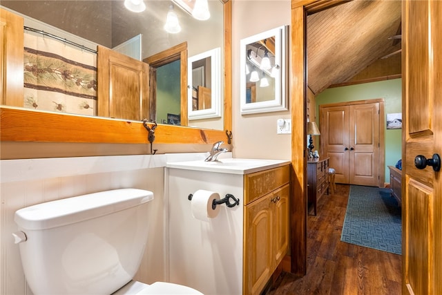 1515 County Road 63, Tuskegee, AL 36083 - full bath with wood finished floors, vanity, and vaulted ceiling
