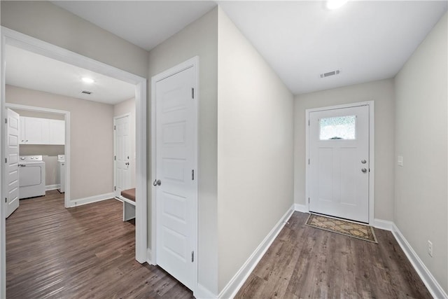 doorway featuring separate washer and dryer, wood finished floors, baseboards, and recessed lighting