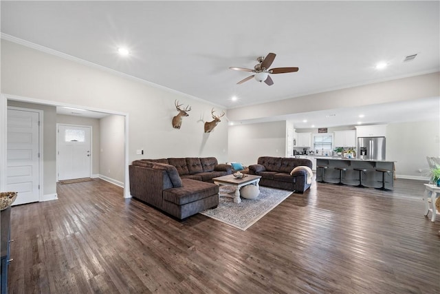 living room featuring ceiling fan, dark wood-type flooring, ornamental molding, baseboards, and recessed lighting