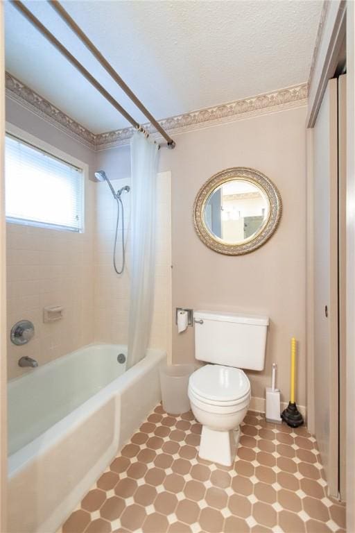 bathroom with toilet and shower / tub combo