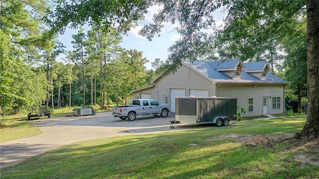 view of side of home with a yard