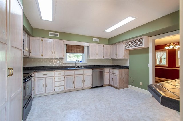 kitchen featuring backsplash, stainless steel dishwasher, black range oven, sink, and pendant lighting