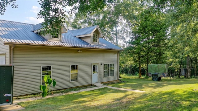 back of house with a yard