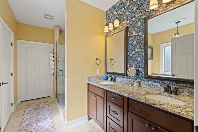 bathroom featuring vanity and a shower with door