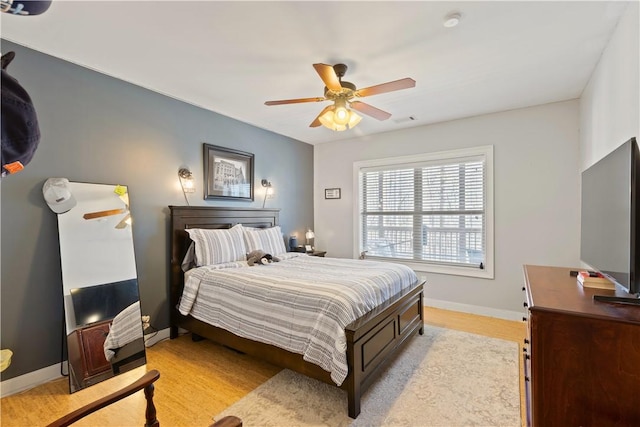 bedroom featuring ceiling fan and light wood-type flooring