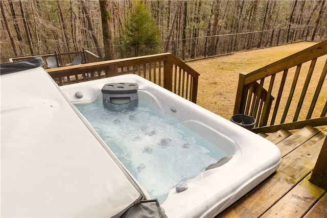 wooden terrace featuring an outdoor hot tub