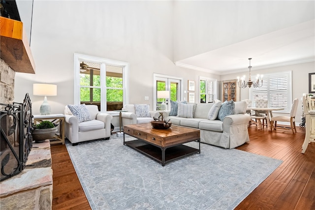 1462 Turn Lake Dr, Auburn, AL 36830 - living room with a chandelier, dark wood-style flooring, a towering ceiling, and ornamental molding