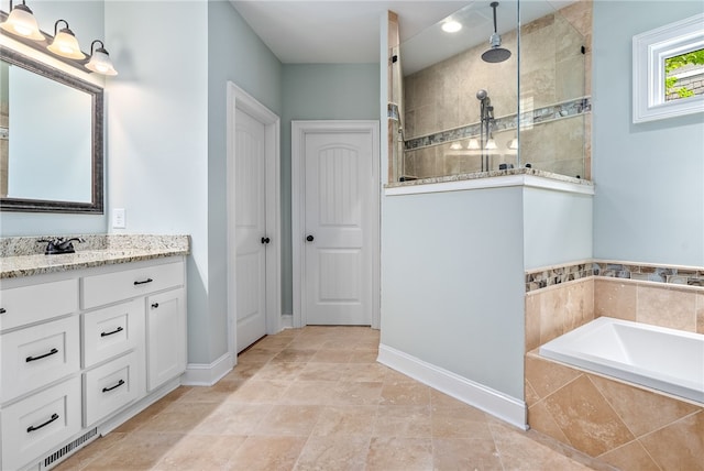 1462 Turn Lake Dr, Auburn, AL 36830 - bathroom featuring vanity, tiled shower, and a garden tub
