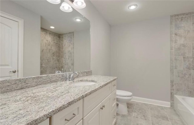 bathroom featuring vanity, tile patterned floors, and toilet