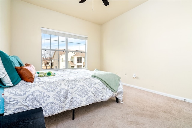 bedroom featuring ceiling fan, carpet, and lofted ceiling